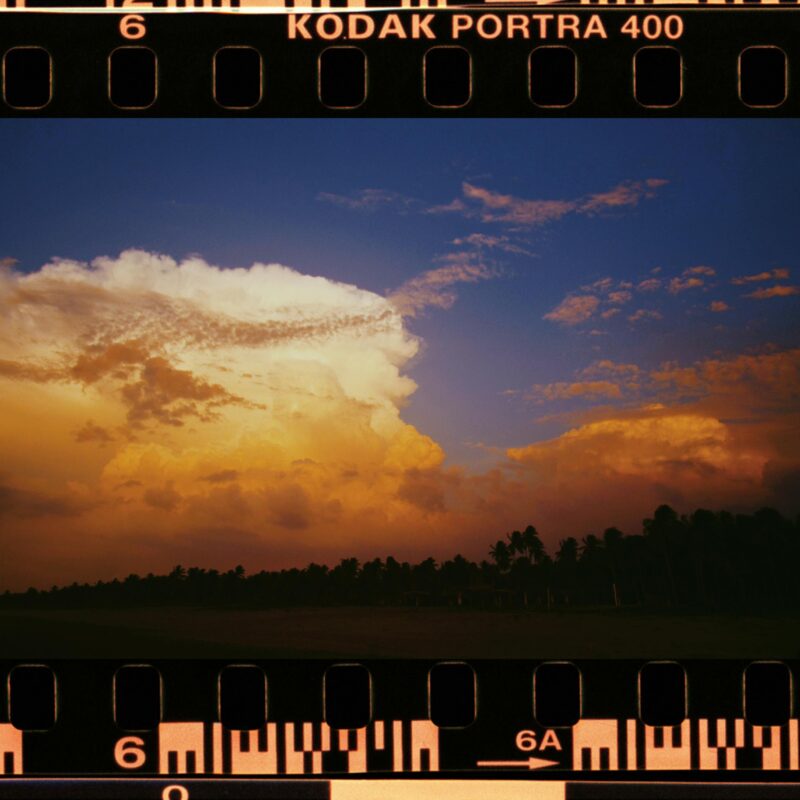 Capture of a vibrant sunset with dramatic clouds on Kodak Portra 400 film.